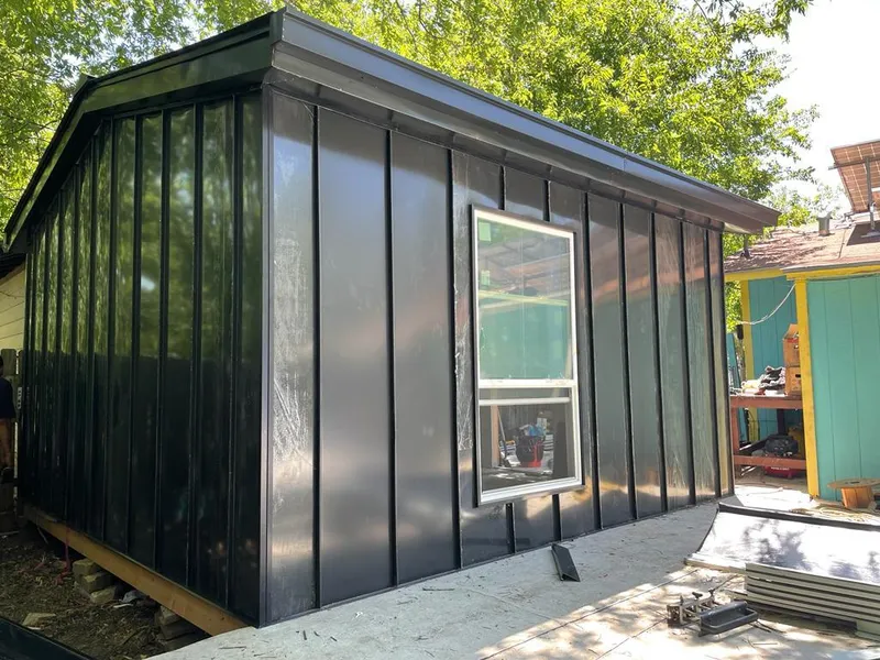 Black standing seam metal wall panels for Roof Inspection in San Dimas