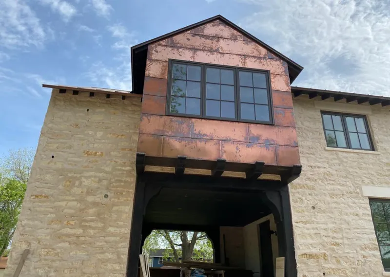 Copper metal panel facade on a stone building for Skylight Installation in San Dimas